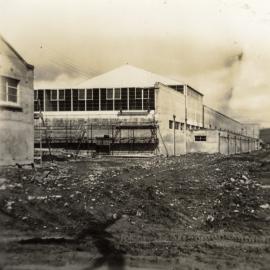 Dunlop factory construction; frontage from the east end; electrical sub-station at left.
