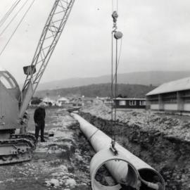 Heretaunga College; stormwater drain; lowering 54" / 8s pipes; Ward Street in the background.