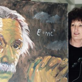 Archibald's Gallery; Mary Archibald with Einstein painting, as part of science festival exhibition.