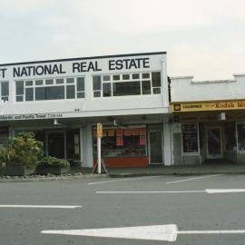 Main Street 1989  2; No. 75-87; First National Real Estate, Atlantic and Pacific Travel, Colorpace. [P2-854-1999]