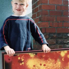 Community Gallery; John Reichel; posthumous display; Josh Krynen with a painting.