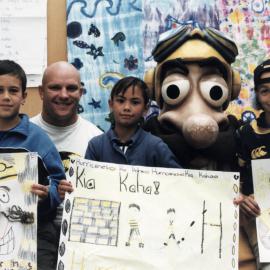 Maoribank School; Captain Hurricane and Bull Allen with Buddy Nuku, 9, Huia Pene, 8, Rema Albrett, 10., 