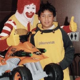 McDonald's re-opens after refurbishment; Walter Treviranus, 12, wins draw for Action Man quad bike.