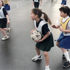 Netball; St Brendan's 'Foxies' in green, 11, Plateau School, gold, 2.