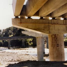 Moonshine bridges; new State Highway 2 bridge; deck beams beginning; old bridge in background