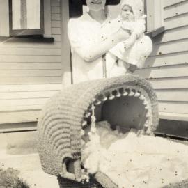 Poulson family; unidentified woman holding Hector and May's daughter Eda