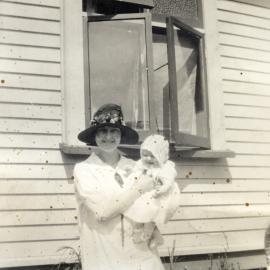 Poulson family; unidentified woman holding Hector and May's daughter Eda