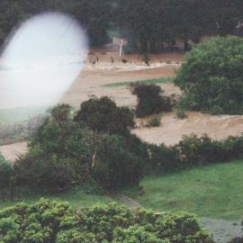 Flood, Karapoti; water crossing the road, in the background; telephoto view. [P1-441-2461]