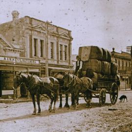 Ken Geange on horse-drawn wagon outside A & W Keys' butchery, Upper Hutt