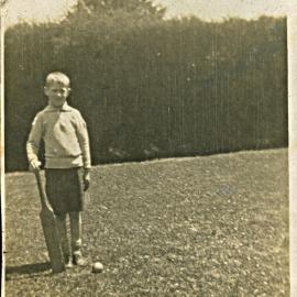 Goodland boy with cricket bat