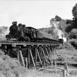 A-class 4-6-2 locomotive No. 604 with train on Mangaroa River bridge - 1953.