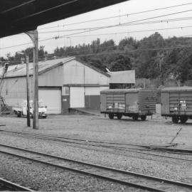 Upper Hutt railway station; goods shed and wagons, seen from the station platform - 1990s.
