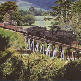 Locomotives A-601 and A-606 with goods train; southbound on Mangaroa River bridge -1953.