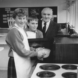 Fergusson Intermediate's first microwave cooker; Louise Hall, Carrigan Smith, Fred Charles.