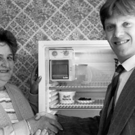 Shirley  Russell receiving refrigerator/freezer donated to Red Cross by Smith and Brown; with their manager Richard Murphy.