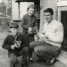 Harry Kent, cyclist (gold medal at Commonwealth Games, 1970) with children and pigeons.