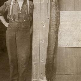 Angus McCurdy with eel, c.1910