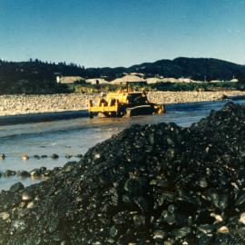 Totara Park Bridge site; bulldozer and ripper excavating Te Awa Kairangi / Hutt River.