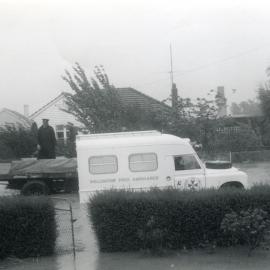 Flood, 1963; view from 32 Moonshine Road, with ambulance passing.