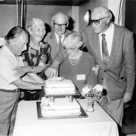 Brown Family reunion; cake being cut; Joan Gaudin, left, and Agnes Golder identified.