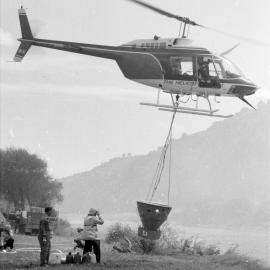Fire, Moonshine Hill Road; helicopter filling its water bucket, 1988