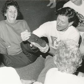 YMCA ''Y's Walking" programme begins; 3-km twilight walks; Edna Whitman's shoe checked by YMCA's Barry Hislop.