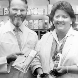 Christine Abbott wins a trip to Rarotonga; with Russell Schultz, owner of Gibbs Pharmacy.