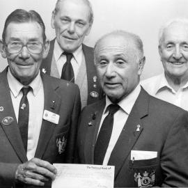 Lions; Wainuiomata Pakeke's Jim Brown and Arthur Martin receive $500 from Upper Hutt's George Solomon and John Pollock.