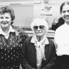 Postbank, Silverstream; tellers Norma Webby and Jai Kemp with Katherine Shaw, 93, in new Kiln Street premises.