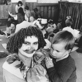 Holiday funtime; 'Buttercup' (Jane Osborne) and Timothy Brewerton, 2, at the Assembly of God Church.