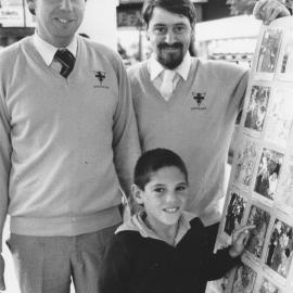Vetmark colouring competition winner Jared Eynon with veterinarians Ray Lord and Peter Miller.