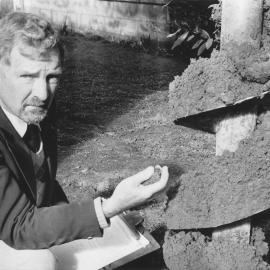 Donald Sim, registered engineer, with rotting sawdust found beneath flats at 54 Whakatiki Street.