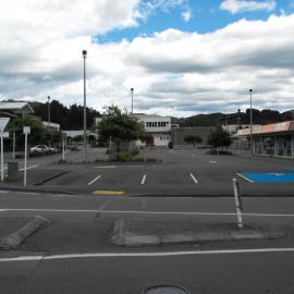 Queen Street, south side; No. 76-82 and Logan Street car parking.