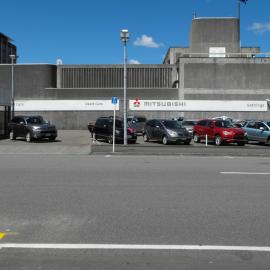 Wilson Street, east side; Gethings Mitsubishi 4; used cars; Police station in the background.