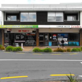 Main Street, south side; No. 152-154 2; Mr Tran Bakery and Coffee, left; Mercury Apartments above.