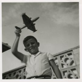 Harris family; John Harris with toy plane, Sandford St, Upper Hutt, c. 1968
