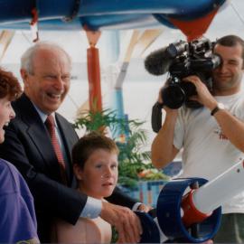 Leisure Centre opening; Governor-General Sir Michael Hardie Boys helping with a water cannon.