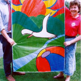 Community liaison staff with summer banner by Heretaunga College
