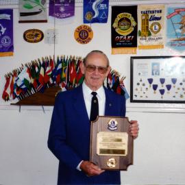 Lions; Silverstream's charter president, Gordon Raikes, with Melvin Jones Felowship Award.