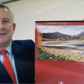 City promotion manager Bruce Page with promotional calendar