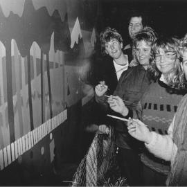 Central Institute of Technology; occupational-therapy students painting a fence mural at a Seddon Street playcentre.