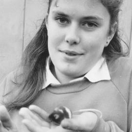 Upper Hutt College student; Rachel Evans, third-former, testing effects of diet on mice.