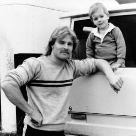 Warren Poston with son John, 2; milk- and 'Leader'-delivery man; Maoribank, Akatarawa, Parkdale.