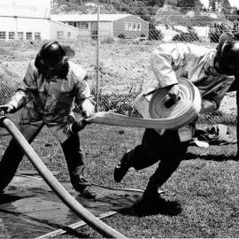 Fire brigades; annual motor industrial competition; General Motors A team changing hoses.