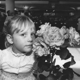 Sarah Jones , 3-1/2, and Sybil Towers's champion rose, Maidstone Mall.