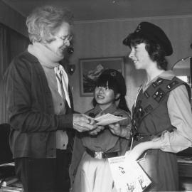 Girl Guides distributing their services directories and Police security leaflets to senior citizens.