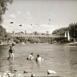 Swimmers in Te Awa Kairangi / Hutt River, upstream from Maoribank suspension bridge.
