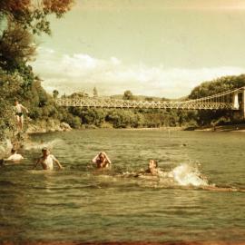 Swimmers in Te Awa Kairangi / Hutt River, upstream from Maoribank suspension bridge.
