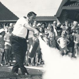 Silverstream Volunteer Fire Brigade; new station opening; November 1974; Mike Day demonstrating a fire extinguisher