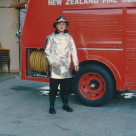 Silverstream Volunteer Fire Brigade; Firefighter in new silver gear, with fire engine